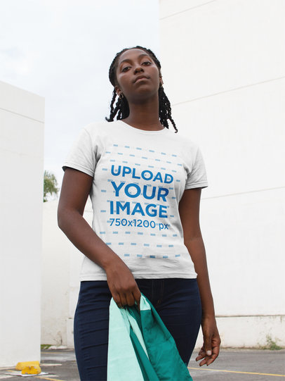 Woman with Locs Posing for the Camera while Wearing a Round Neck Tee Template at a Parking Lot