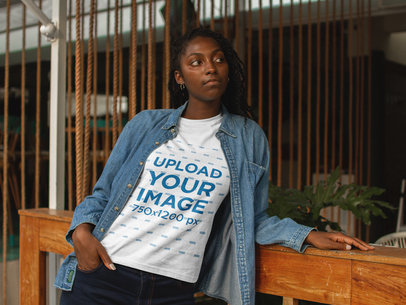 Mockup of a Woman Wearing a T-Shirt While Waiting at the Restaurant 17325