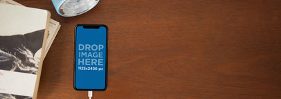 Charging iPhone X Mockup Lying on a Wooden Nighstand a17381