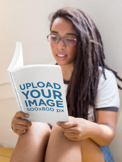 Mockup Featuring a Woman with Glasses Reading a Book