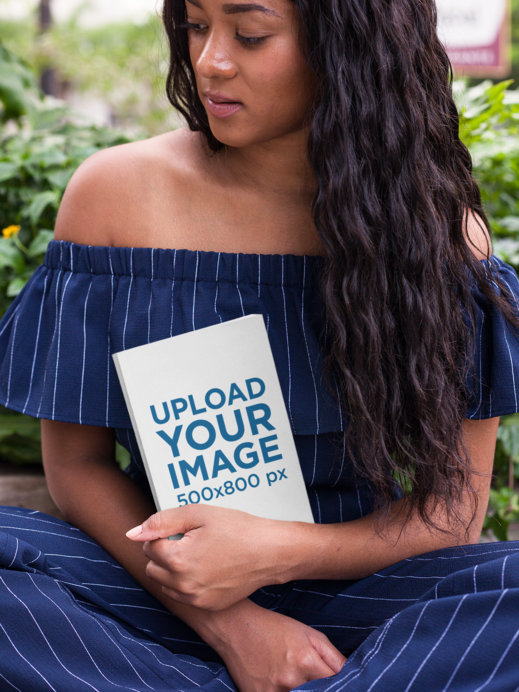 Mockup of a Woman Holding a Book While at the Park