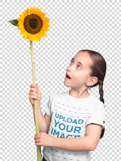 Transparent Little Girl Holding a Big Sunflower Wearing a T-Shirt Mockup Against a Blue Wall with Clouds