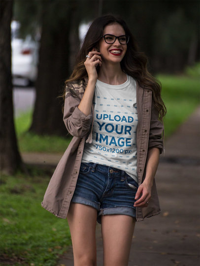 Happy Beautiful Woman Walking in the Park Wearing a T-Shirt Mockup