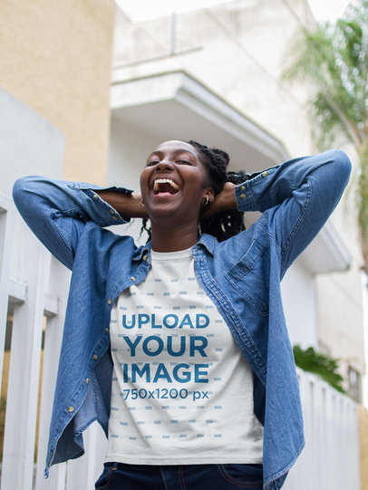 Mockup of a Smiling Woman Wearing a T-Shirt While Walking in the Street