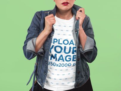 T-Shirt Mockup of a Cropped Face Woman Standing Against a Paper Background
