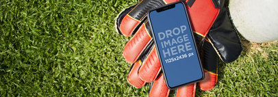 Mockup of an iPhone 11 Pro Lying on a Soccer Field