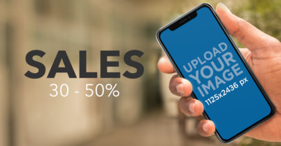 Mockup of a Man Holding an iPhone 11 Pro