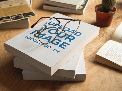 Three Books Mockup Lying on top of Each Other and Round Glasses