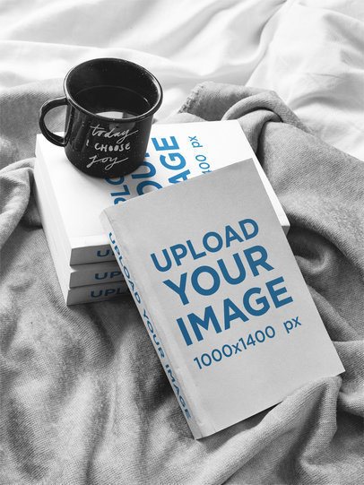 Cup of Coffee Over Books Mockup on a Bed a17405