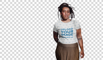 Transparent Sublimated T-Shirt Mockup of a Tattooed Woman with Locs Against an Old Wall