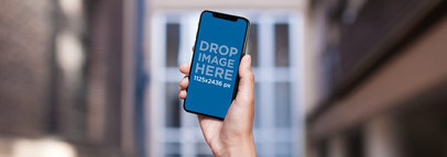 iPhone 11 Pro Mockup Held While at the City