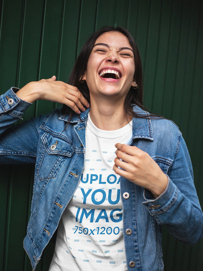 Happy Woman Wearing a T-Shirt Mockup and a Denim Jacket