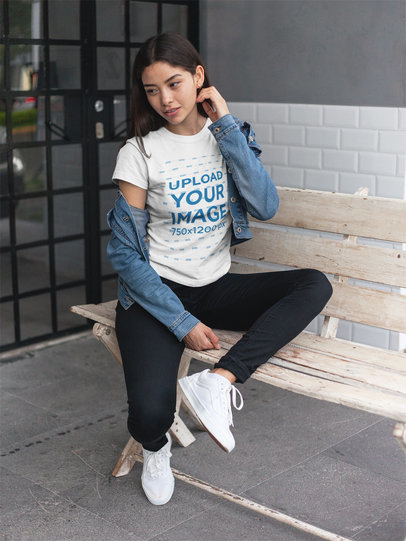 Mockup of an Asian Woman Wearing a T-Shirt on a Bench