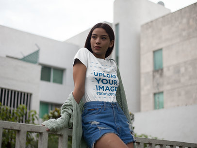 Asian Woman Sitting on a Fence Wearing a Round Neck Tee Mockup