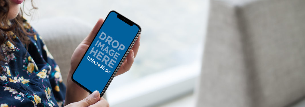 Woman with Flowers Clothing Using an iPhone 11 Pro Mockup