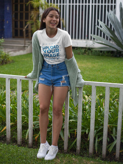 Happy Beautiful Woman Wearing a Round Neck Tee Mockup in her Garden
