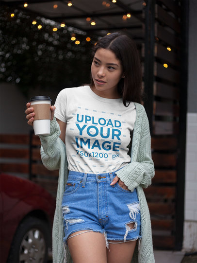 Tshirt Mockup of an Asian Woman Having a Coffee Outdoors