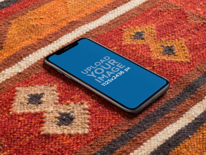 iPhone X Mockup Lying on a Red Carpet a17504