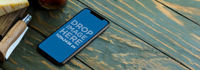 iPhone 11 Pro Mockup on a Green Wooden Table