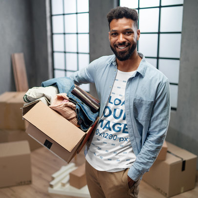 T-Shirt Mockup of a Smiling Man Moving into a New Apartment
