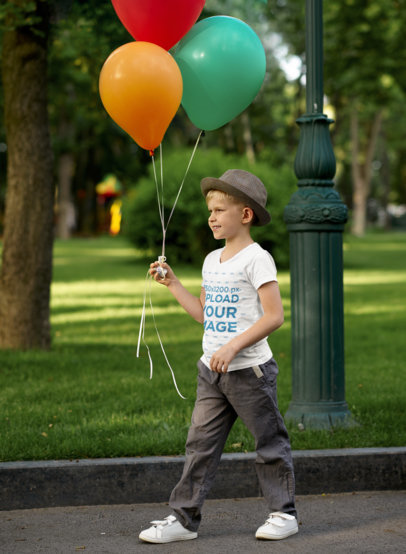 V-Neck T-Shirt Mockup Featuring a Happy Boy Holding Colorful Balloons