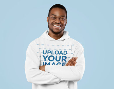 Mockup of a Joyful Man Wearing a Hoodie and Posing With His Arms Crossed 