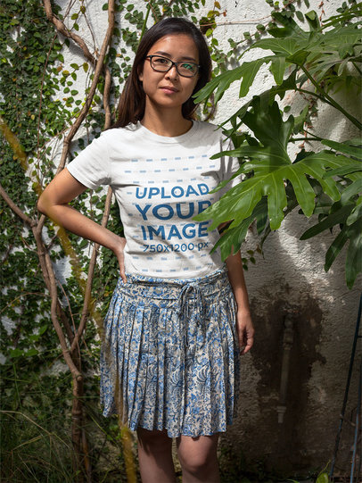 Asian Girl Wearing a T-Shirt Mockup While Next to Plants a17604