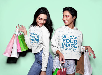 Crop Top Hoodie Mockup Featuring Two Happy Friends With Shopping Bags