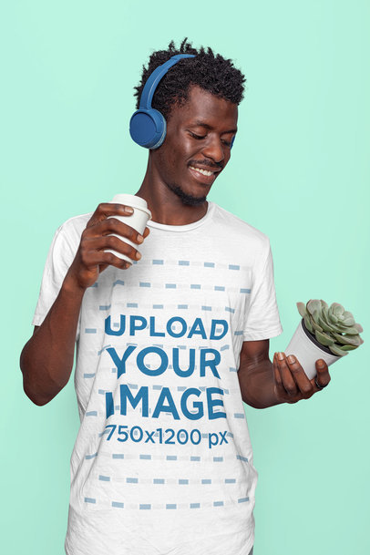 Round-Neck Tee Mockup of a Happy Man with Headphones at a Studio