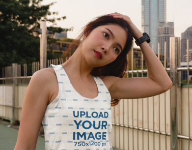 Tank Top Mockup of a Woman Stretching Her Neck Before a Workout