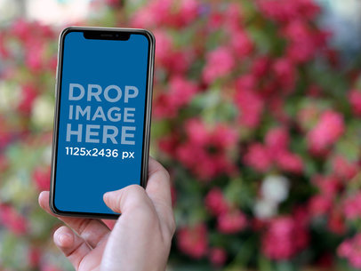 iPhone X Template Held Against Flowers a17667