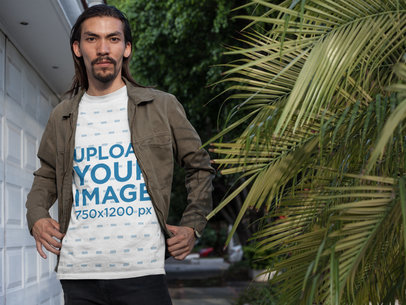 Asian Man Posing in the Street Wearing a T-Shirt Mockup