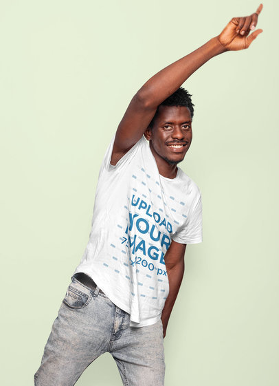 Round-Neck Tee Mockup of a Smiling Man Raising His Arm 