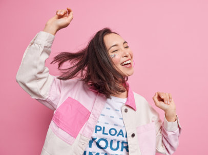 T-Shirt Mockup of a Happy Woman Dancing at a Studio