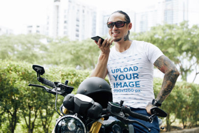 T-Shirt Mockup of a Happy Tattooed Man Talking on the Phone While Riding a Motorbike m16242 r-el2