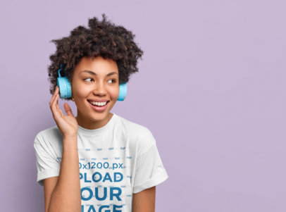 Basic Tee Mockup of a Curly-Haired Woman Listening to Her Favorite Music m17850-r-el2