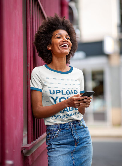 Ringer T-Shirt Mockup of a Woman Laughing and Checking Her Phone