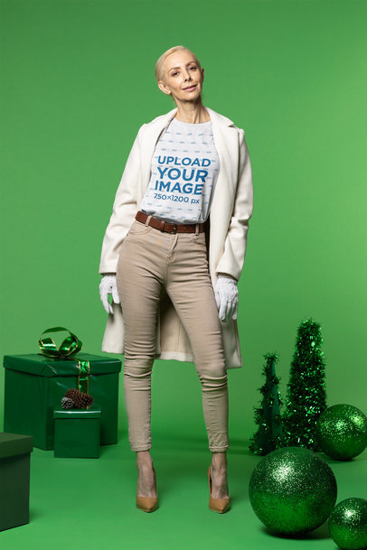 T-Shirt Mockup of a Trendy Elderly Woman Posing in a Christmas-Themed Set m17890
