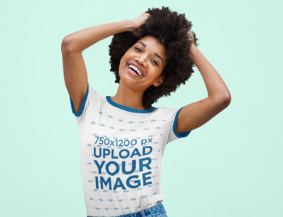 Ringer T-Shirt Mockup Featuring a Joyful Woman With an Afro Hairstyle Posing in a Studio