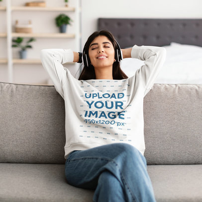 Sweatshirt Mockup Featuring a Happy Woman Relaxing with Headphones at Home