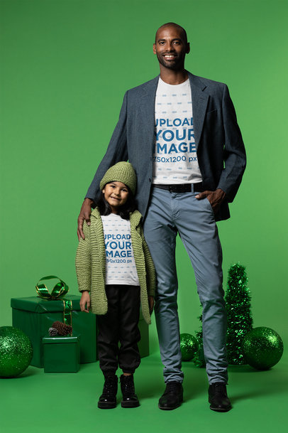 T-Shirt Mockup of a Girl and Her Dad in a Christmas-Themed Setting
