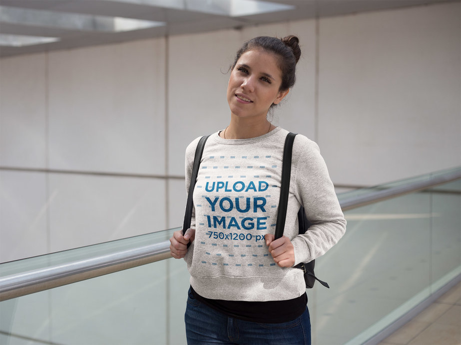 Smiling Woman with Backpack Wearing a Crewneck Sweatshirt Template at the Airport