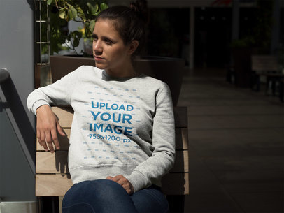 Woman Sitting on a Bench Wearing a Crew Neck Sweatshirt Template