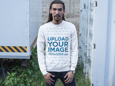 Long Haired Man with Beard Wearing a Crewneck Sweatshirt Template Near Containers