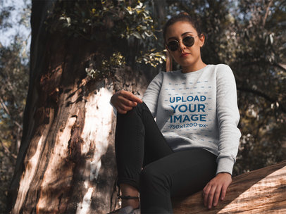Woman Sitting in the Woods Wearing a Crew Neck Sweatshirt Template