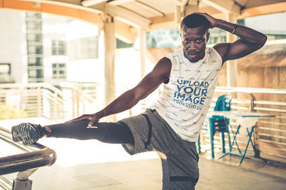 Sleeveless T-Shirt Mockup of a Man Stretching His Leg