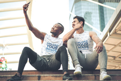 Sleeveless Tee Mockup of Two Friends Taking a Selfie