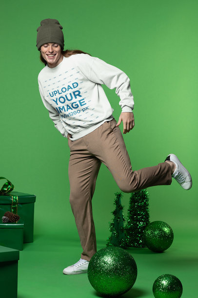 Xmas-Themed Mockup of a Man Posing Playfully in a Sweatshirt