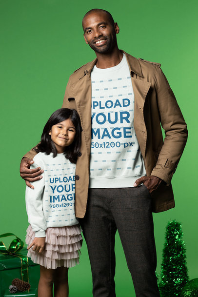 Sweatshirt Mockup of a Man Hugging a Girl Next to Christmas Presents