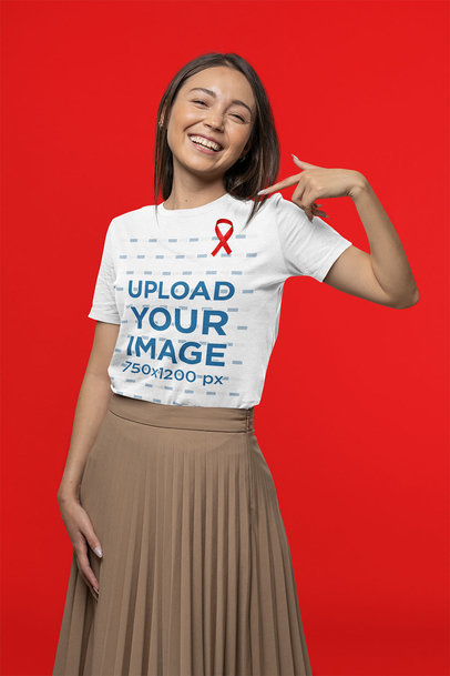 Basic Tee Mockup of a Joyful Young Woman Pointing at Her AIDS-Awareness Ribbon m17176